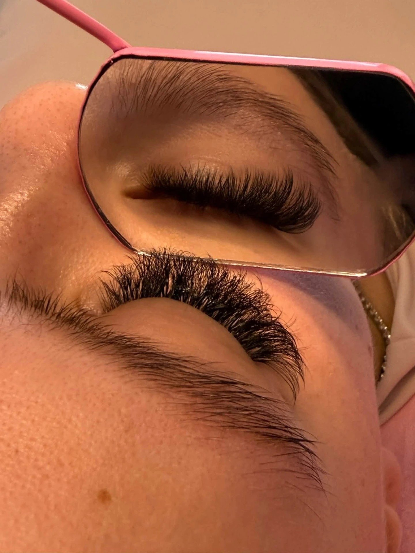Volume lashes viewed in a lash mirror